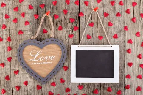 Empty wooden blackboard sign and heart shape frame Stock Photos