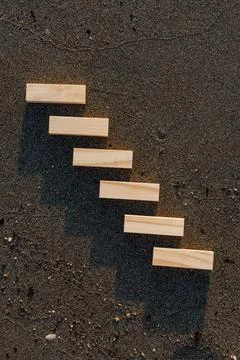 Empty wooden blocks with copy space for text on sandy summer beach background Stock Photos