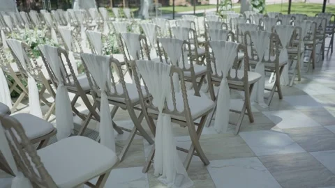 Empty Wooden Chairs With White Chiffon Drapes at Outdoor Wedding Stock Footage 345303963