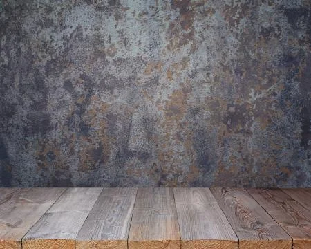 Empty wooden deck on the background of old walls. Stock Photos