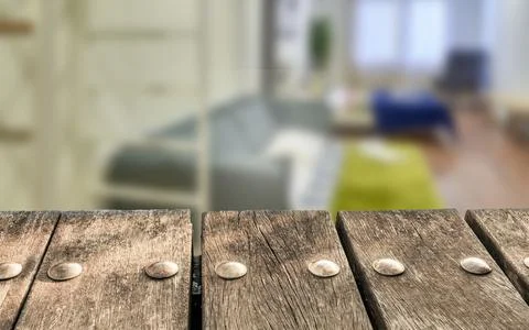 Empty wooden deck table on blurry hotel room background. Can be used for mock Stock Photos