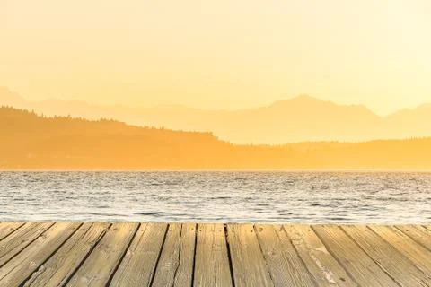 Empty wooden deck table top Ready for product display montage with sea,mounta Stock Photos