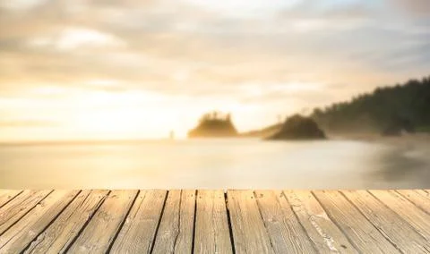 Empty wooden deck table top Ready for product display montage with sea,sunset Stock Photos