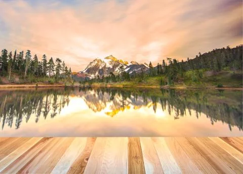 Empty wooden deck table top Ready for product display montage with mountain w Stock Photos