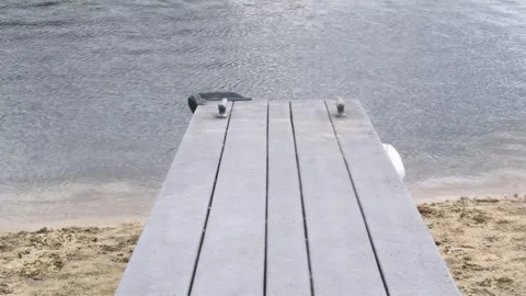 Empty Wooden Dock Over rippling Water - 4K High Angle - Serene Nature Background Stock Footage 331663689