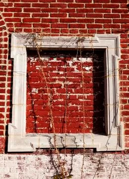 Empty wooden frame on red bricks wall Stock Photos