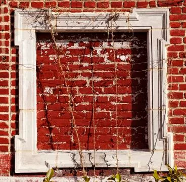 Empty wooden frame on red bricks wall Stock Photos