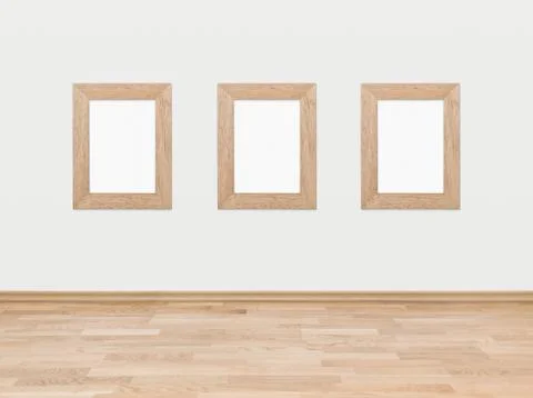 Empty wooden frames on a white wall Stock Photos