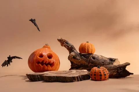 Empty wooden log on table with pumpkin and bats. Halloween or Thanksgiving mo Stock Photos