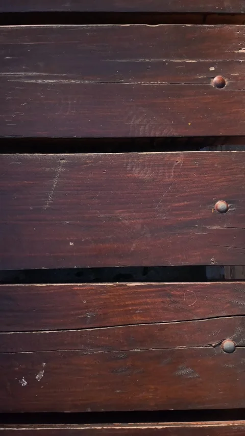 Empty wooden park bench, outdoor leisure and quiet waiting concept. Stock Footage 342977372
