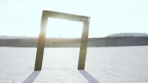 Empty wooden picture frame on the beach sand Stock Illustration
