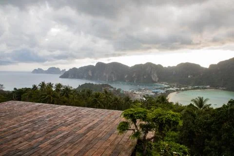 Empty wooden platform with Phi Phi island views and cloudy sky Stock Photos