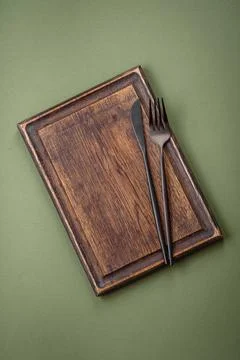 Empty wooden rectangular cutting board on a plain background, flatley with... Stock Photos
