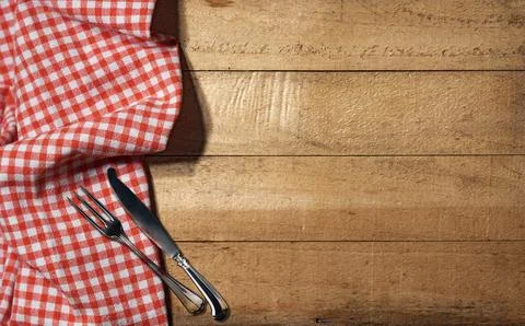 Empty Wooden Rustic Table with Checkered Tablecloth and Cutlery Stock Photos