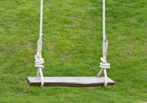 Empty wooden swing Stock Photos
