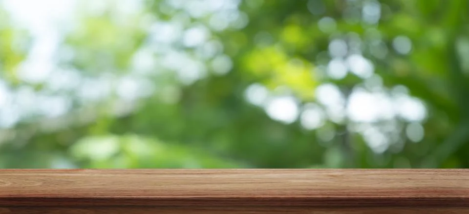 Empty wooden table background and blurry green background on the agricultur.. Stock Photos