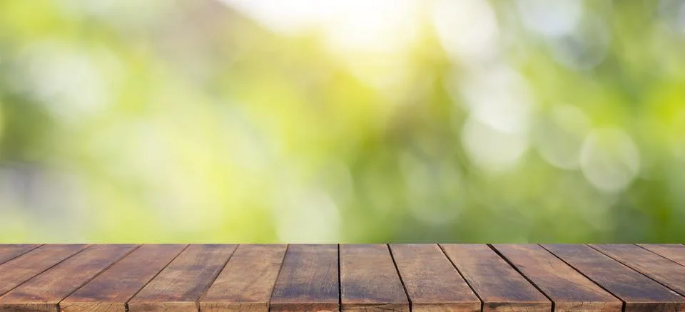 Empty wooden table background and blurry green background on the agricultur.. Stock Photos