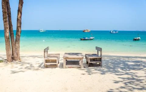 Empty wooden table on the beach Stock Photos