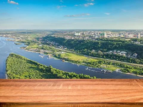 Empty wooden table with blurred background of aerial view of the Volga river  Stock Photos