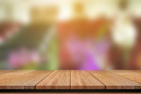 Empty wooden table with blurred background for product display. Stock Photos