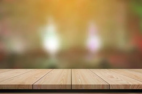 Empty wooden table with blurred background for product display. Stock Photos