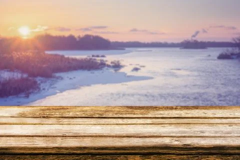 Empty wooden table with blurred picteresque winter background Stock Photos