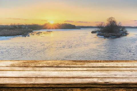Empty wooden table with blurred picteresque winter background Stock Photos