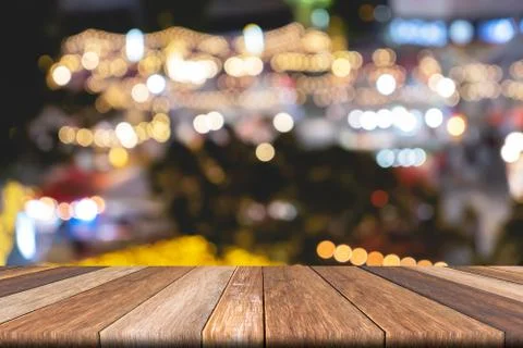 Empty wooden table of brown on front blurred colorful background, for present Stock Photos