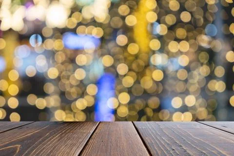 Empty wooden table of brown on front blurred colorful background, for present Stock Photos