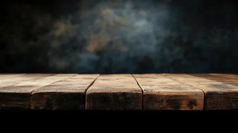 Empty wooden table with dark background for product display or presentation Stock Photos