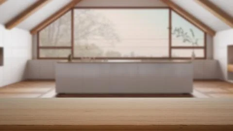 Empty wooden table, desk or shelf with blurred view of attic penthouse kitc.. Illustrazione stock