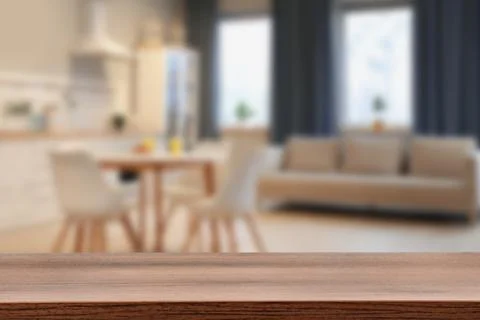 Empty wooden table in dining room. Space for design Stock Photos