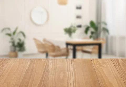Empty wooden table in dining room. Space for design Stock Photos