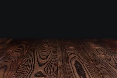Empty wooden table float up on dark background Stock Photos