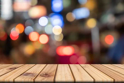 Empty wooden table in front abstract blurred bokeh colorful background, used  Stock Photos