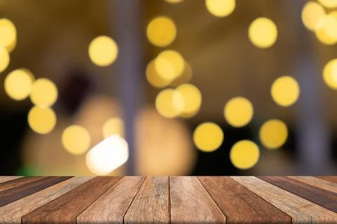 Empty wooden table in front blurred yellow background, for presentation and t 库存照片