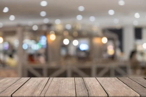 Empty wooden table in front blurred yellow background, for presentation and t Stock Photos