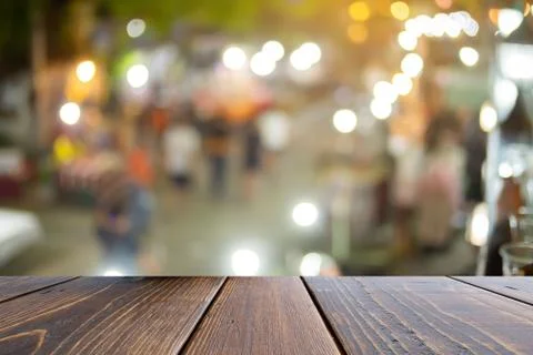 Empty wooden table in front blurred abstract background, desk and blurred con Stock Photos