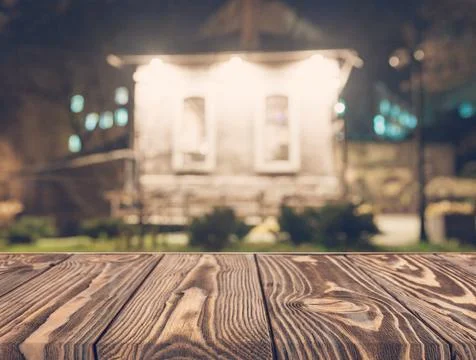 Empty wooden table front blurred house backdrop Stock Photos