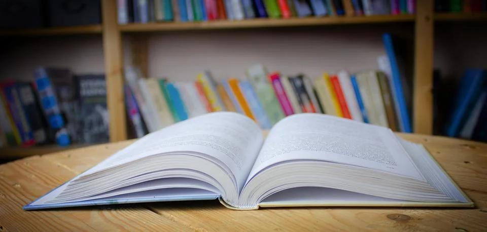 Empty wooden table on library background. Copy space Stock Photos
