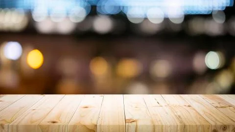 Empty wooden table platform and bokeh at night Stock Photos