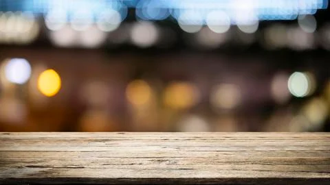 Empty wooden table platform and bokeh at night Stock Photos
