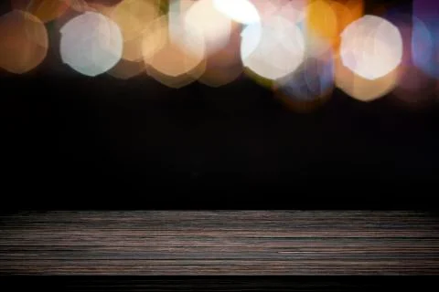Empty wooden table platform and bokeh at night. Stock Photos