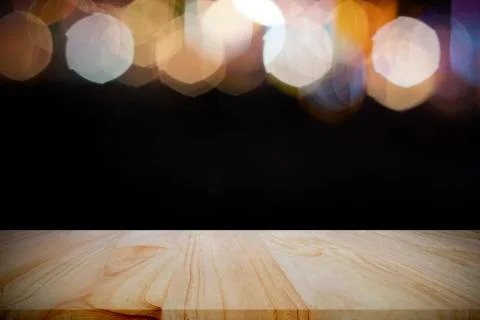 Empty wooden table platform and bokeh at night. Stock Photos