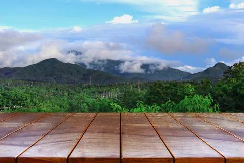 Empty wooden table space platform and Mountain and sky background for product Stock Photos