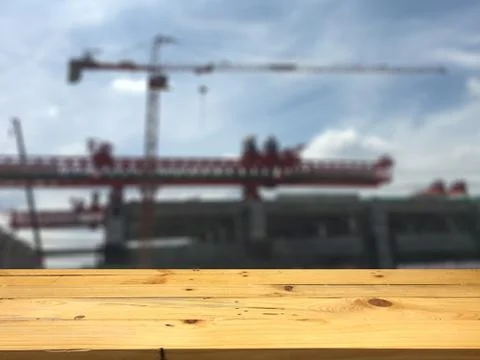 Empty wooden table space platform and blurred Construction area background fo Stock Photos