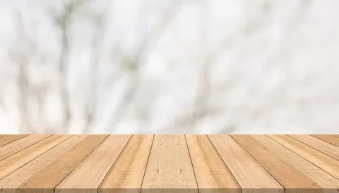 Empty wooden table surface with blurred natural background Stock Photos