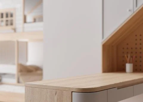 Empty wooden table top and blurred kids room interior on the background. Copy Illustrazione stock