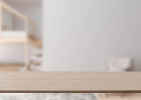 Empty wooden table top and blurred kids room interior on the background. Copy Stock Illustration