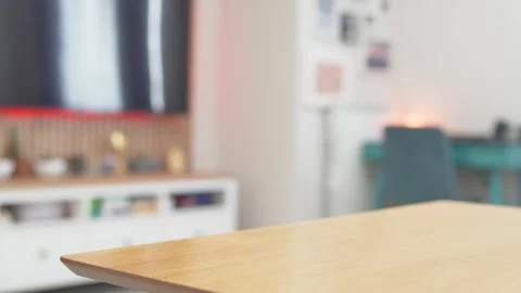 Empty Wooden Table Top with Blurred Modern Living Room Stock Footage 306670161